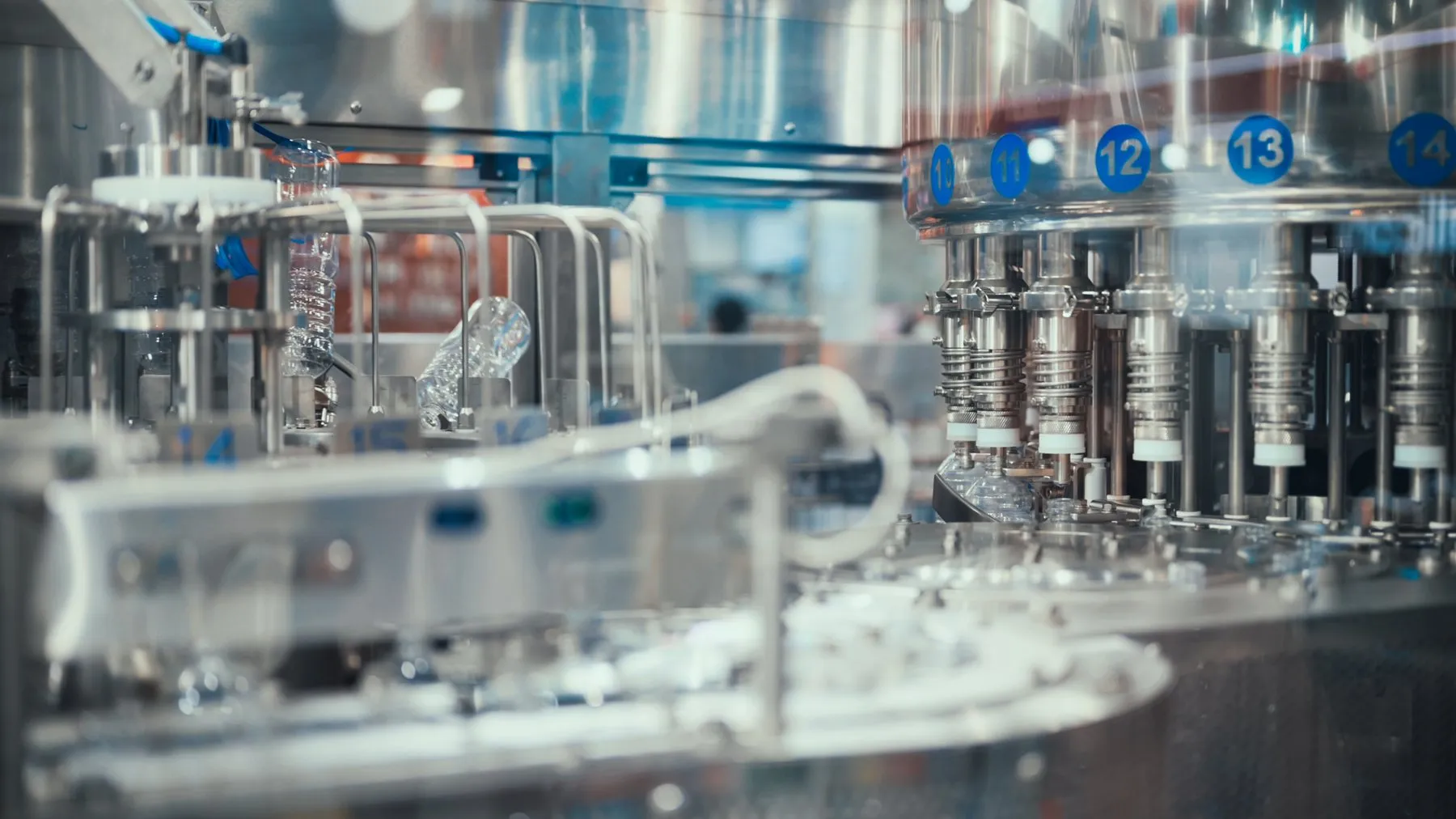 Automated bottle filling line in a manufacturing plant